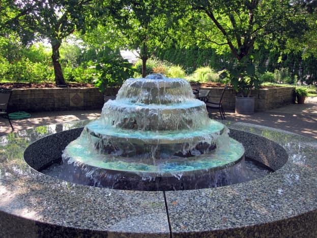 The large, formal fountain is the focal point of the test garden's central plaza.