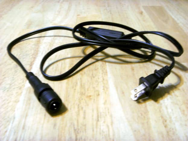 A typical power cord.  You can just see the tip of the prongs on the end that attaches to the rope lighting.