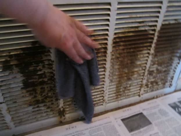 After sanding down the rust, clean vents with damp cloth.