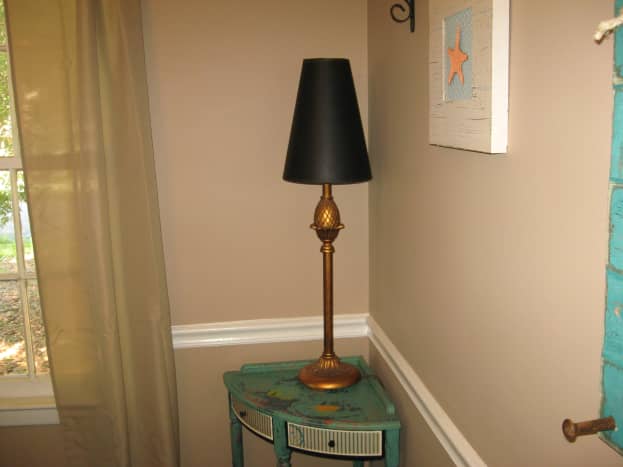 A tall, slim lamp helps to brighten up a dark corner.