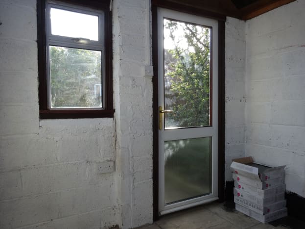 Recycled window and uPVC door fitted in shed