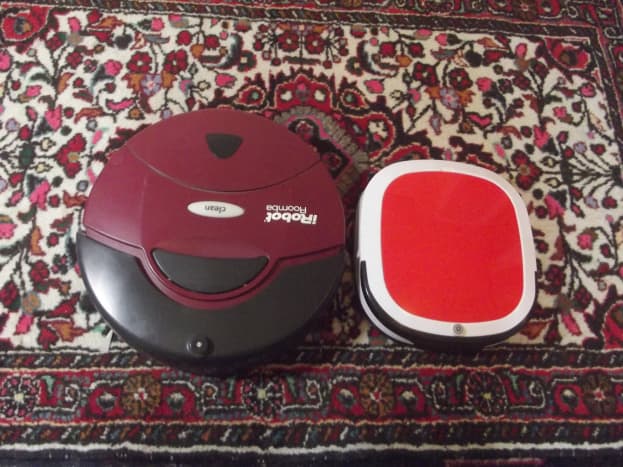 iRobot Roomba 401 alongside WOHOME Robotic Vacuum Cleaner