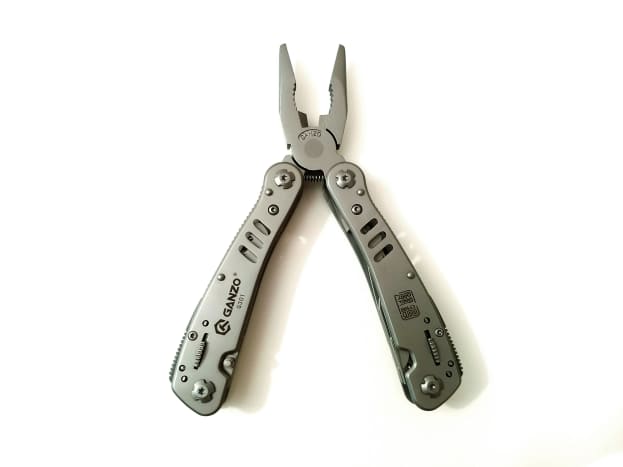 Spring-loaded pliers.