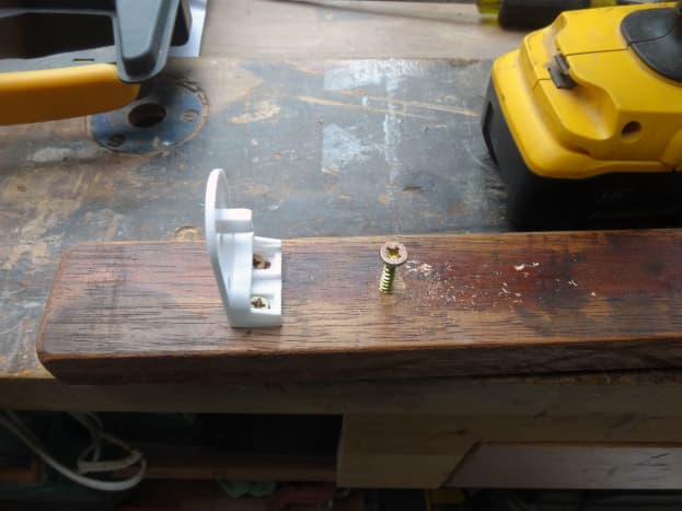 Fitting brackets to teak wood, and predrilling holes for fitting to the conservatory wall.  