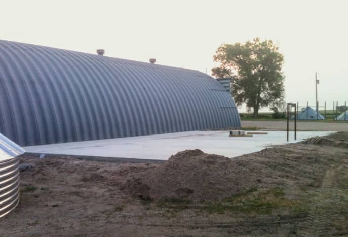This slab has been carefully worked and cured in order to properly bear the weight of a full grain bin. The site was scraped and filled with builders sand to provide a proper base.
