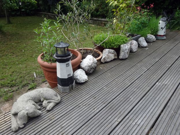The quartz stones found in a rockery in the garden, cleaned with the pressure washer and now taking pride of place on our decking.