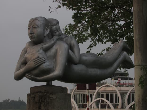 Statue by riverbank of Perfume River, Hue