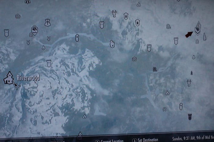 Follow the arrow to travel to Windhelm. From there find the dock and travel to Solstheim.