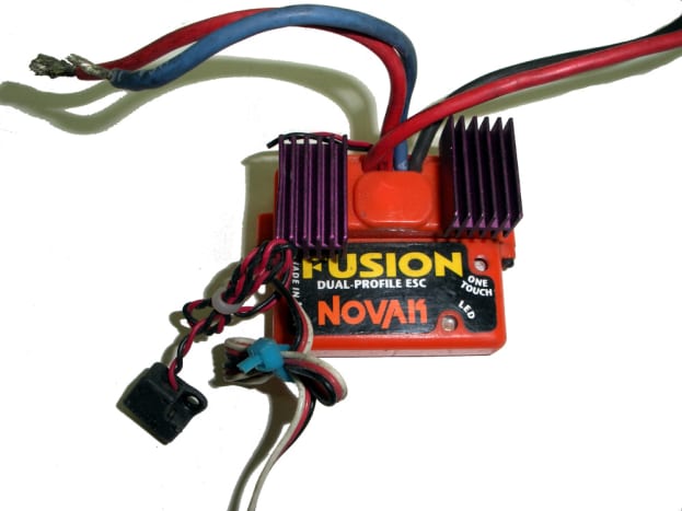 ESC for brushed motors. Note 2 sets of leads at top--one goes to battery pack, the other to motor.  The connectors at bottom go to the receiver.