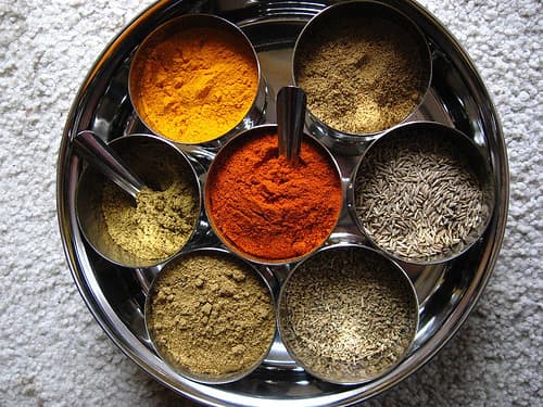 Spices, including cumin, cayenne, tumeric, and corriander.