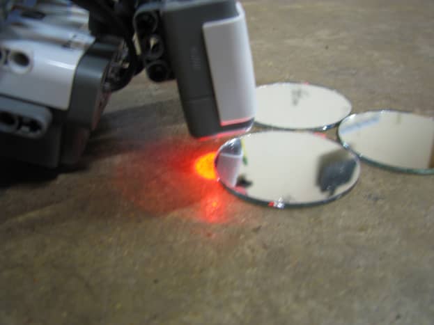 Lego robot using light sensor to find mirrors.