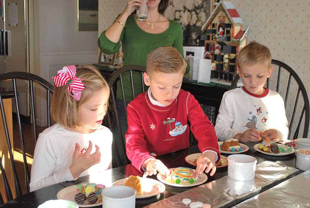 Cousins making a cake train