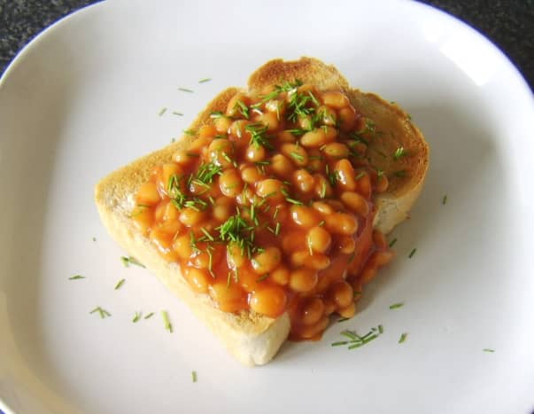 Baked beans with garlic served on a thick slice of toasted farmhouse bread and garnished with chopped chives.