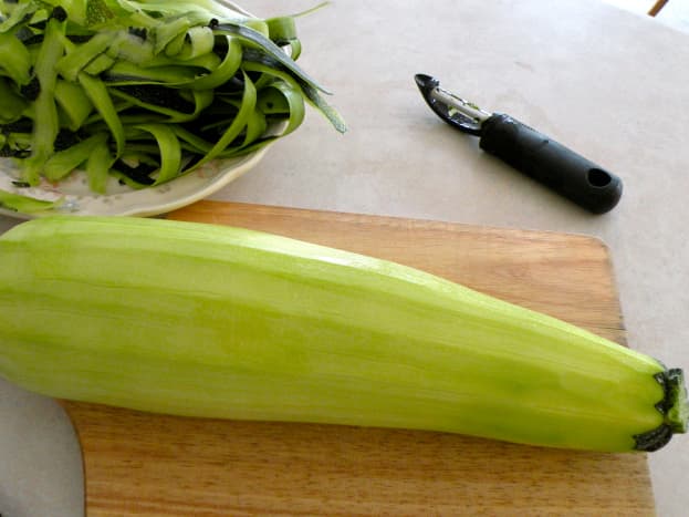 Peel zucchini and cut off blossom and stem ends. Remove seeds from larger zucchinis.