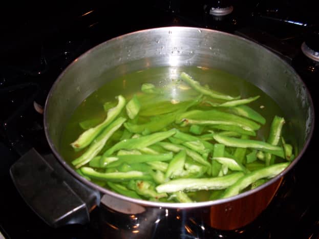 First, boil green peppers for three minutes.