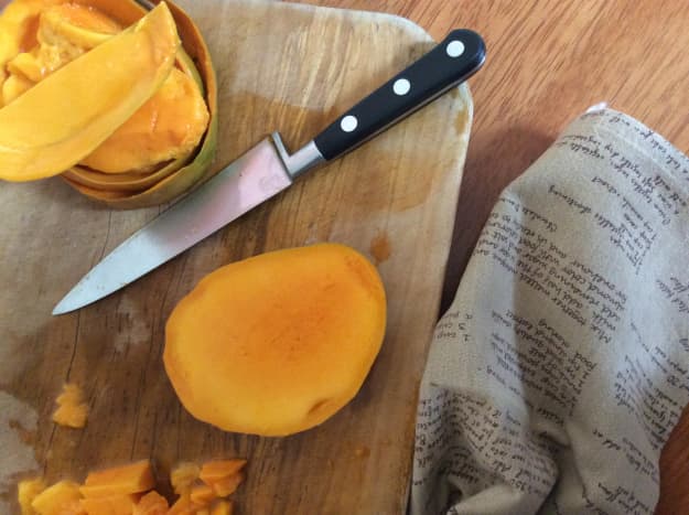 Split the mangoes and cut out the flesh dicing it up into small chunks.