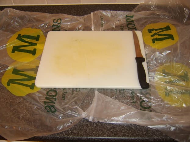 Plastic bags make clearing up easier after the ling is filleted