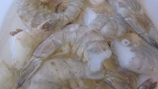 Thaw frozen shrimp in cold water or use fresh shrimp.