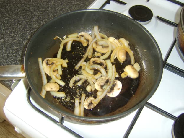 Mushrooms and onion are fried with sage 