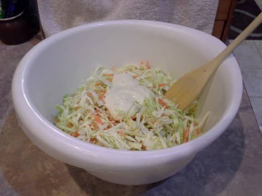 Shred your veggies and add in your coleslaw dressing.