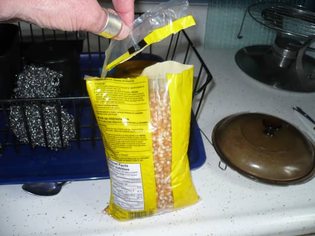 Cut the entire top off the bag of popcorn