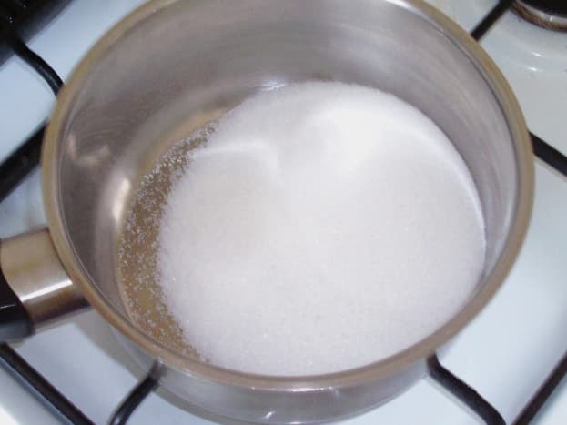 Sugar for sugar syrup is added to saucepan