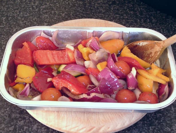 Oiling and seasoning vegetables for roasting