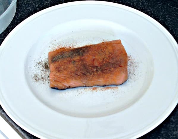 Salmon is spiced before being left to marinate