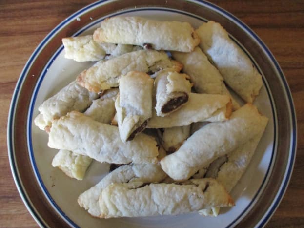 Homemade nut rolls on a plate.