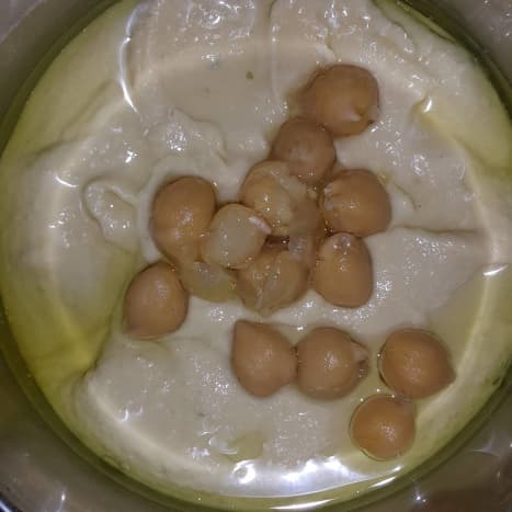 Hammus (mashed chickpeas blended with light spices and olive oil) served with khubz (traditional flatbread of Kuwait).