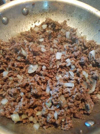 Steps 3 and 4: Add onion to browned hamburger. Stir. Cook until onion is almost transparent.