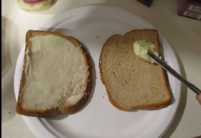 Spread the frosting on the bread.