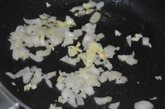 Step one: Saute crushed garlic and chopped onions in coconut oil.
