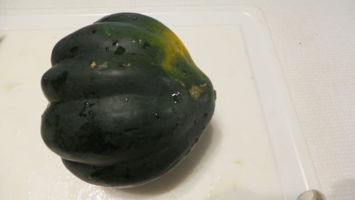 1. Cut both ends of the acorn squash. 