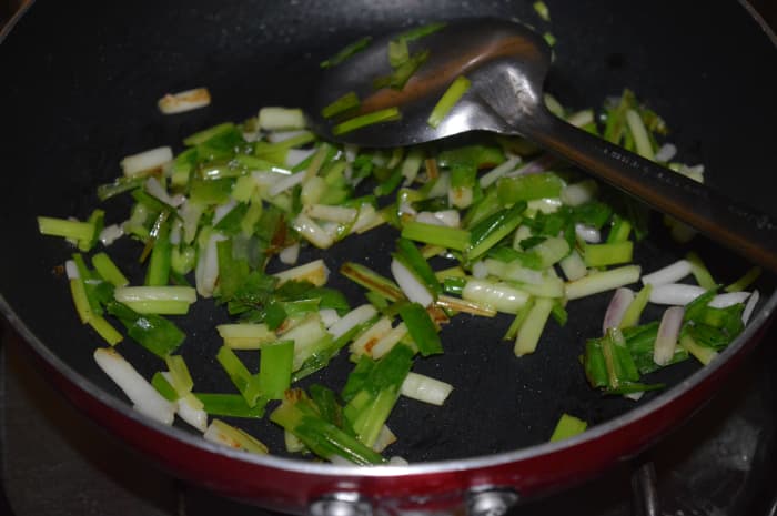 Step one: Saute chopped spring onions and green peas in butter or olive oil as per instructions. Add some salt. Mix well.
