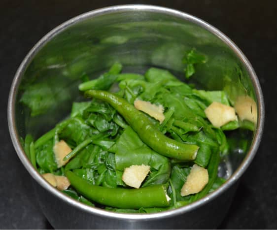 Step one: Make a puree of blanched spinach, ginger, and green chilies.