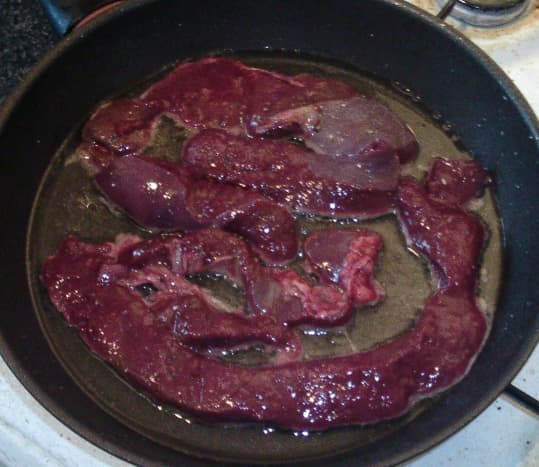 The liver is added to the frying pan to be quickly browned and sealed.