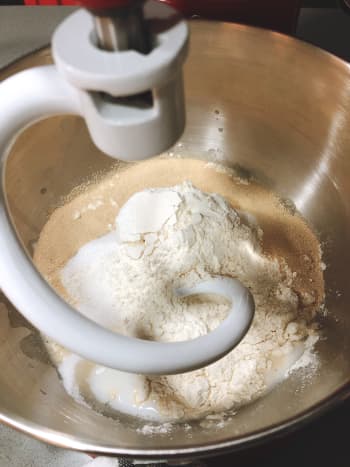 Combine the flour, sugar, warm water, yeast, and milk in the mixing bowl. 