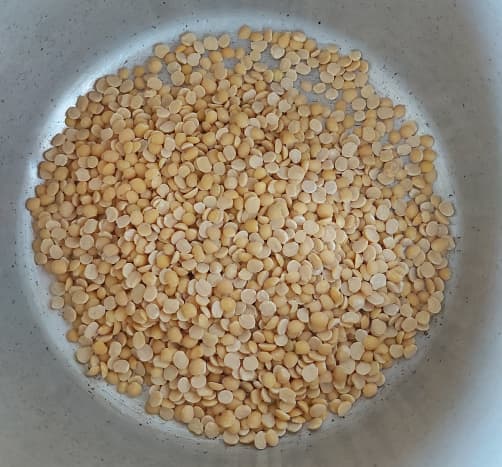 In a cooker, add 1 cup of dal. I used toor dal, but you can use moong dal, masoor dal or a mix.
