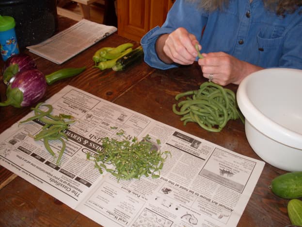 Snap the green bean ends, and remove strings as necessary. Discard any discolored, soft, or otherwise faulty beans.