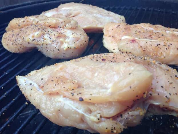 raw chicken on the grill