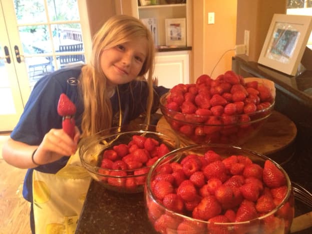 Hulling strawberries is a big job!