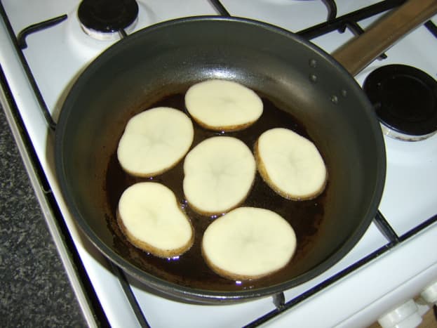Pan frying the potato slices