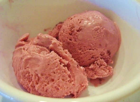 Two scoops of eggless raspberry ice cream. 
