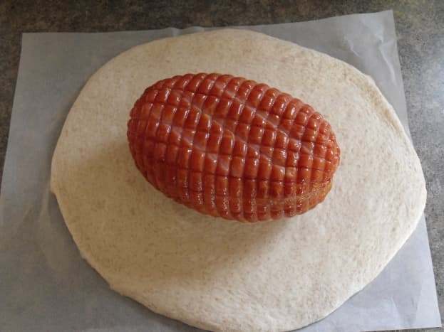 Wrap ham in rolled-out dough