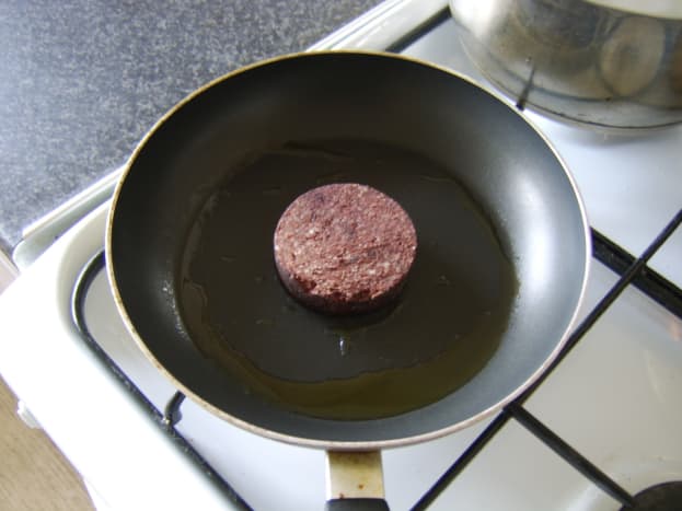 Black pudding is shallow fried in olive oil