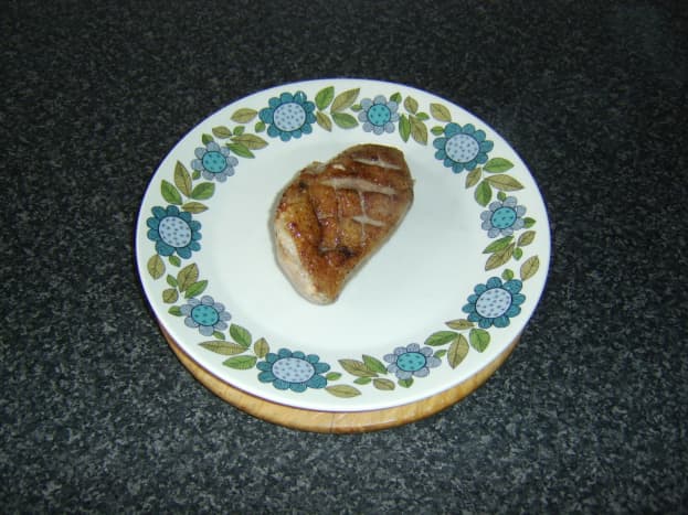 Rest duck breast on a warmed plate