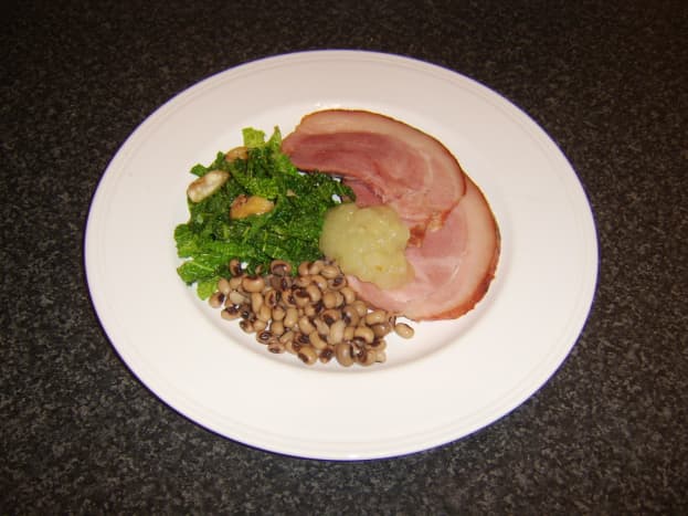 This three-times-lucky New Year dish incorporates roast ham, sauteed Savoy cabbage and black-eyed peas.