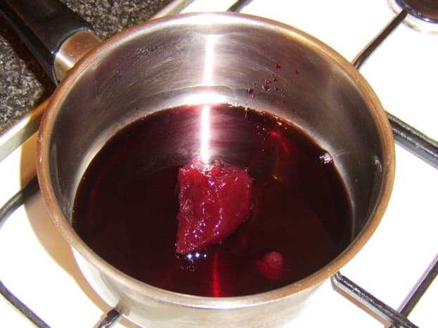 Red wine and whole berry cranberry sauce is reduced
