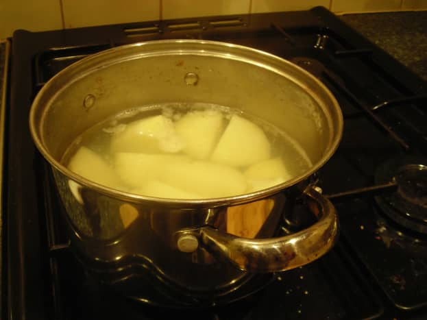 Potatoes cut in pieces, boiling